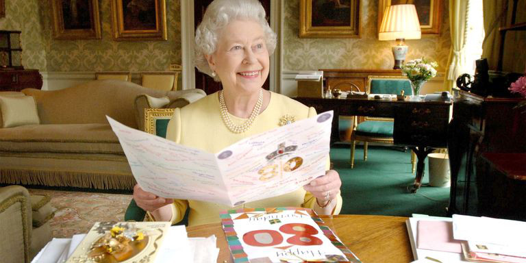 Queen Elizabeth II reading 80th birthday cards